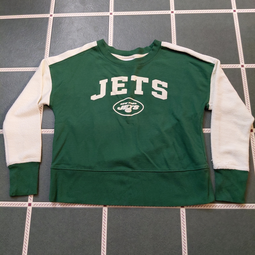 NFL Teens Apparel Tag on White Fabric with Pink Logo